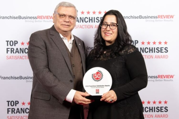 School of Rock corporate team accepts award 