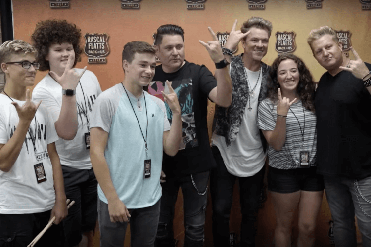 school of rock cornelius poses with rascal flatts